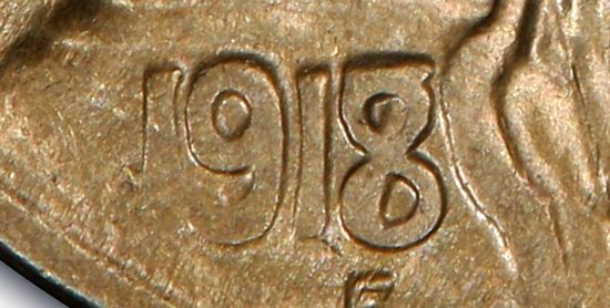 Close-up of the 1918/7-D overdate Buffalo nickel date showing the ghost of the 7 beneath the 8